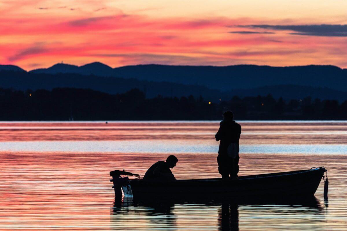 standing on boat during golden hour